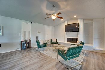 A living room with a fireplace and a television.